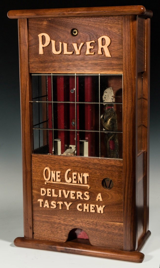 PULVER CHEWING GUM MACHINE MECHANISM IN WOOD CASE: A custom made wood case with cut-out wood letters; Pulver gum machine mechanism with repainted figure. Measures 22 x 12.5 x 6.5 inches. We ship in-house for all items with the exception of very large 