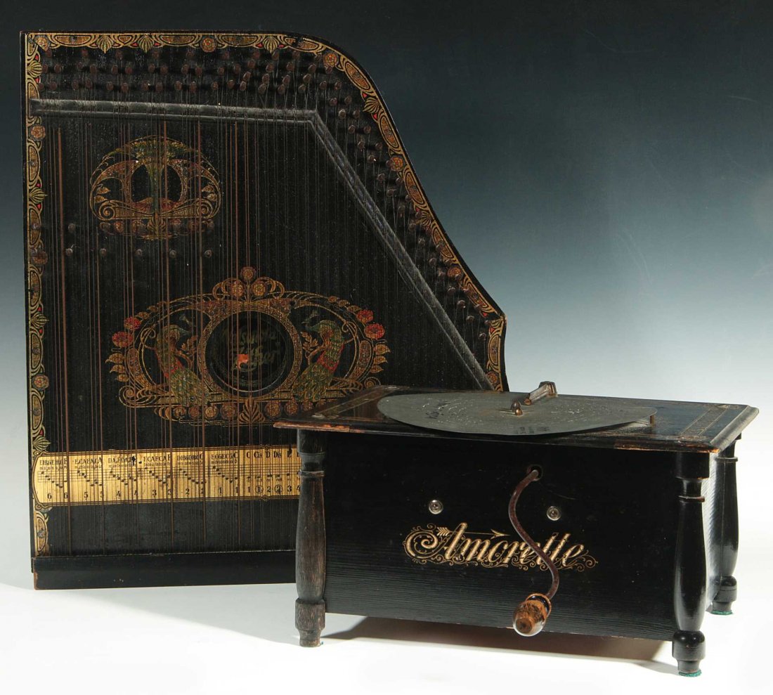 A 19TH CENTURY MECHANICAL MUSIC DISC MACHINE: An Amorette hand crank organ 7 x 10.5 x 13.75 inches, plus an ebonized Valsonora zither that measures 20 x 17.75 inches. We ship in-house for all items with the exception of very large and or very fra