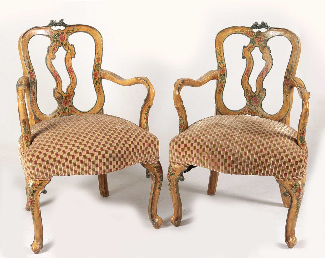 A PAIR EARLY 20TH C. VENETIAN ROCOCO ARM CHAIRS: Each in the Venetian Rococo style with double arched crest rail and pierced carved foliate handhold, on serpentine stiles and centering an open vasiform splat painted with sprays of flower and foliate