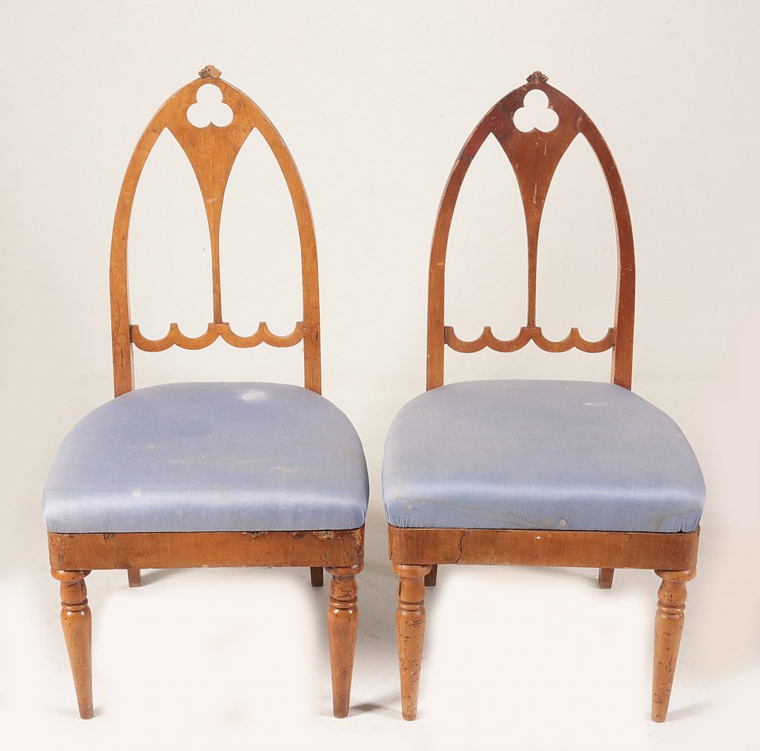 A PAIR 19THC. CONTINENTAL GOTHIC FRUIT WOOD CHAIRS: Pointed arch crest rail tipped with carved crocket over pierced trefoil and lancet pierced splat surmounting a square seat, straight seat rail and raised on two front turned and tapering legs. Upholst