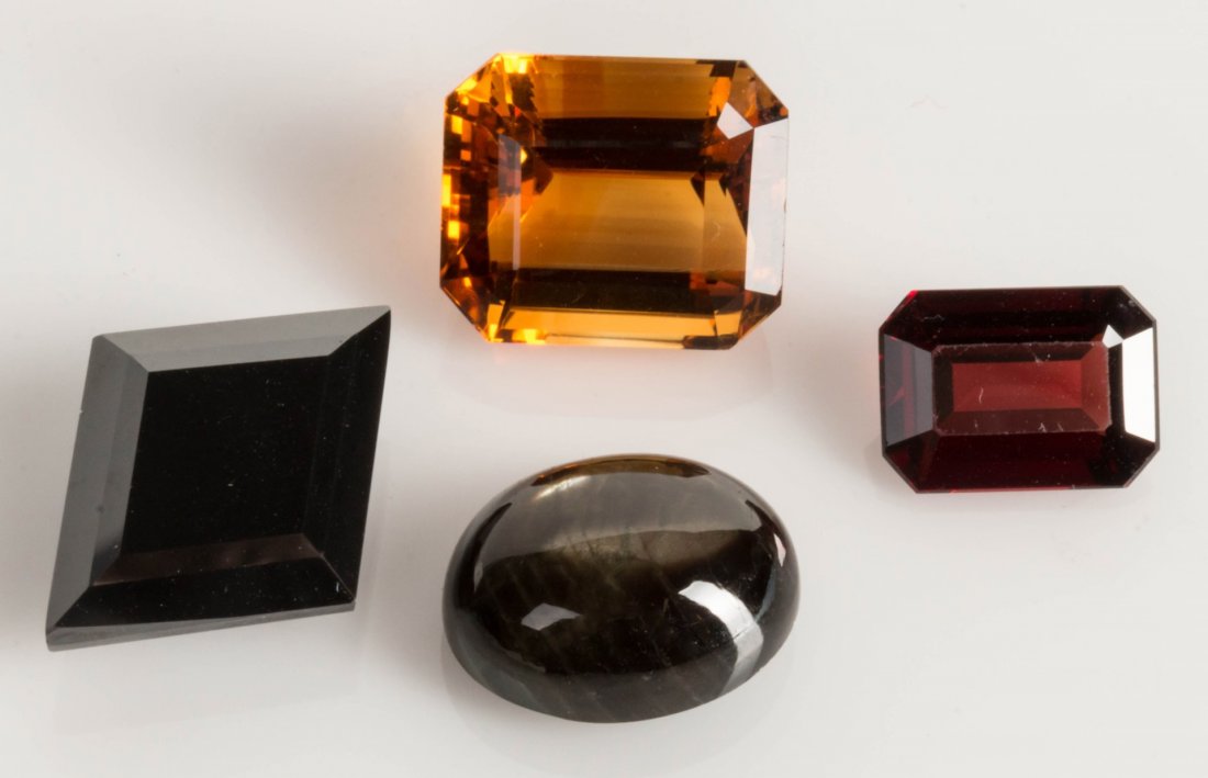 CITRINE, ALMONDITE GARNETAND HEMATITE GEMSTONES: Emerald cut 21.7 carat Citrine that measures 17 x 14mm; emerald cut 7.70 carat Almondine Garnet that measures 14 x 10mm, seven brilliant cut Brazilian Emeralds that measure 2.5mm each, diamond shaped