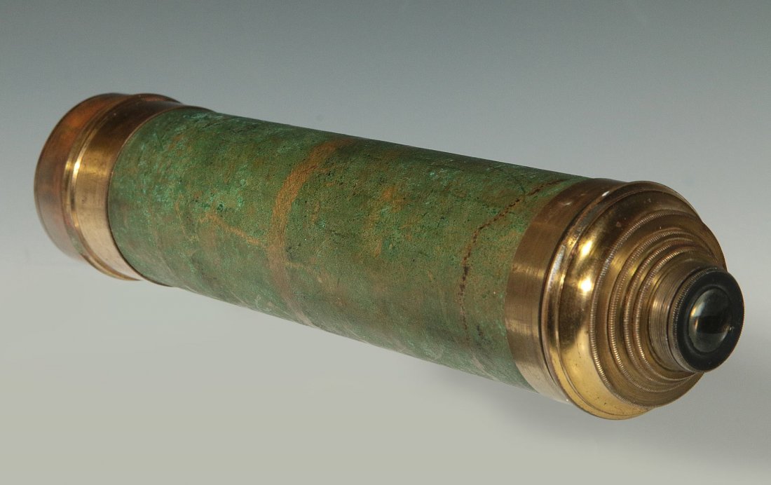 A 19TH C. FOUR DRAW BRASS TELESCOPE: A four draw brass telescope, sans its original leather covering. Measures 23.75 inches fully extended. We ship in-house for all items with the exception of very large and or very fragile pieces and so