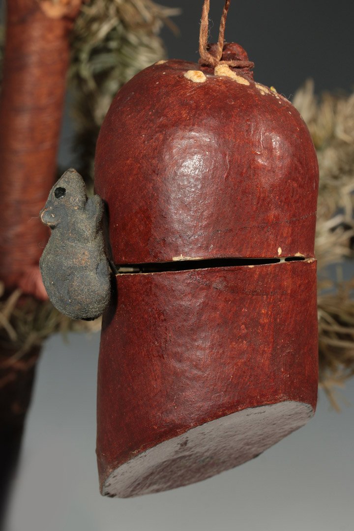 ANTIQUE GERMAN PAPIER MACHE CANDY CONTAINER: An antique papier mache candy container depicting a mouse and salami, printed paper details, flocking on the mouse, paper hinge, measures 4.5 inches.