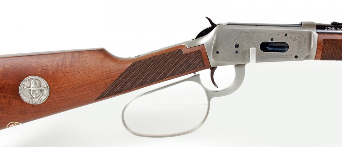WINCHESTER 'JOHN WAYNE' MODEL 94 - NEVER FIRED: Winchester 32-40 Caliber Model 94 John Wayne Commemorative lever action rifle, serial number JW44069, circa 1981, large loop, Never Fired, Complete Original Box, three boxes of ammo with matching grap