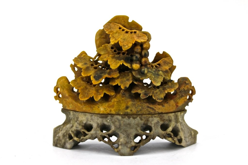 Chinese Yellow InkStone Carved Mountain: Chinese Yellow InkStone Carved with Grape and leaves Mountain on a Grey stone base. 5 x 4 1/2 x 1"