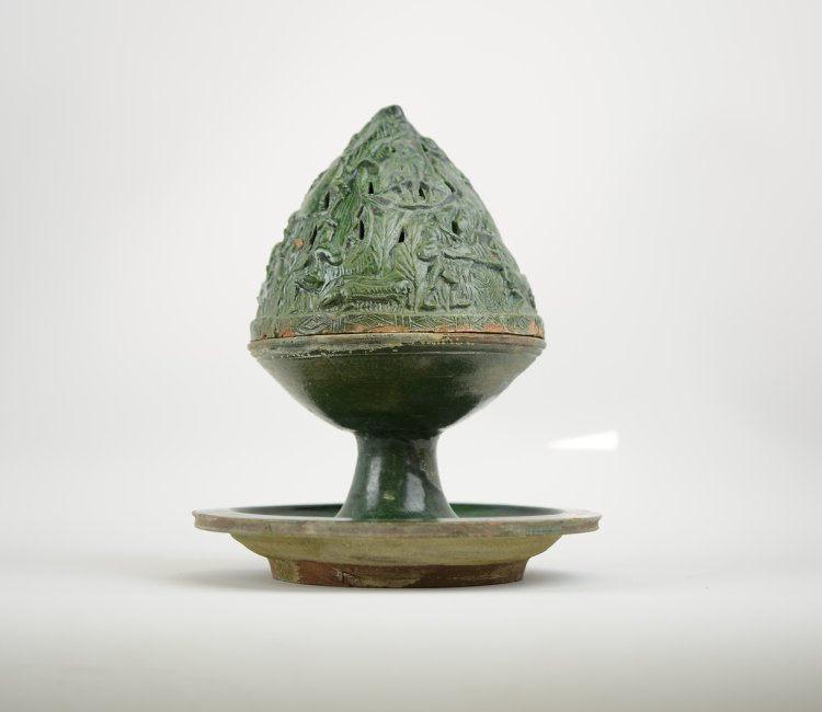 Chinese Porcelain Boshanlu, probably Han Dynasty.: Green Glazed Porcelain Boshanlu, Probably Han Dynasty, the two piece pierced mountainous censor on cylindrical stem rising from a wide circular dish; 4 DIA 9 1/2 H; Provenance: Ex-collection of Robert