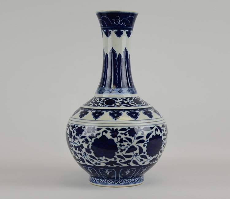 An Important 19th Century Blue and White Vase (Cracked): An Important 19th Century Chinese Blue and White Vase; of shang ping form, the vase created by imperial workshops as a gift from the emperor to his high officers, the elongated neck with underglaze pa