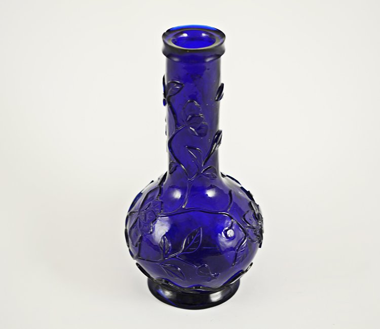 19th Century Chinese Peking Glass Bottle Vase: 19th Century Chinese Peking Glass Bottle Form Vase, the cobalt blue glass carved with flowering peony branches, raised on a ring foot; appx. 9 3/8 H.