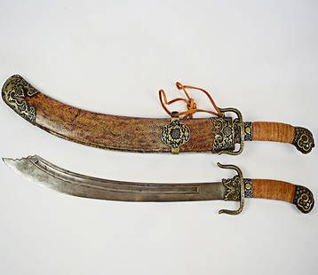 18th Century Chinese Broadswords in Sharkskin Scabbard: A Pair of 18th century Broadswords in Sharkskin Scabbard with Enameled Brass Decoration, the sword handles mounted with enameled brass decoration and rope wrapped grips, the sharkskin scabbard with