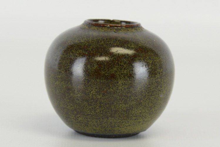 Chinese Teadust Glazed Porcelain Vase: Chinese Teadust Glazed Porcelain Vase, of rounded form, with gold teadust glaze over a bronze colored ground, the base with later Qianlong marks, the vase with a small chip to the mouth; appx. 2 1/4 i