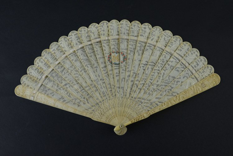 19th Century Chinese Export Ivory Fan: 19th Century Chinese Export Ivory Fan, the brisé fan comprised of thinly cut ivory sticks carved with scenes of Chinese life on highly translucent string cut ground, with a central roundel painted in