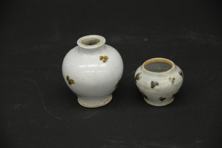 Yuan Dynasty Chinese Glazed Jar & Mei Ping Vase: Yuan Dynasty Glazed Jar and Mei Ping Vase, the jar of mei ping form, with a wide mouth, the white glazed body decorated with underglaze copper red flowers, restoration to the interior where cracked, t