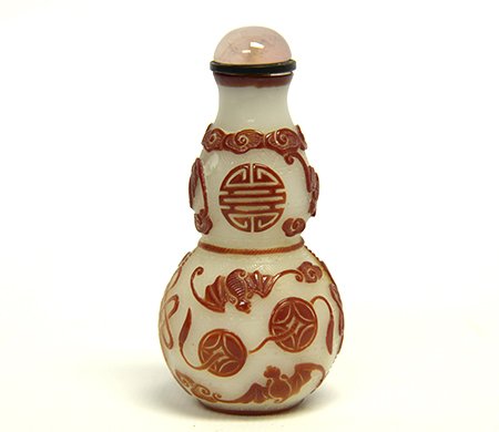 Chinese Peking Glass Double Gourd Snuff Bottle: Chinese Peking Glass Double Gourd Snuff Bottle, carved through ruby red overlay to incised milky white glass body with bats, stylized shou characters, endless knots and strings of cash, appx. 3 in. H,