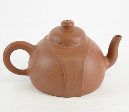 Chinese Yixing Clay Teapot: Chinese Yixing Clay Teapot, of compressed form, the teapot carved with a raised band running around the mouth and down each side tapering toward the base, the base with incised signature, appx. 7 1/4 