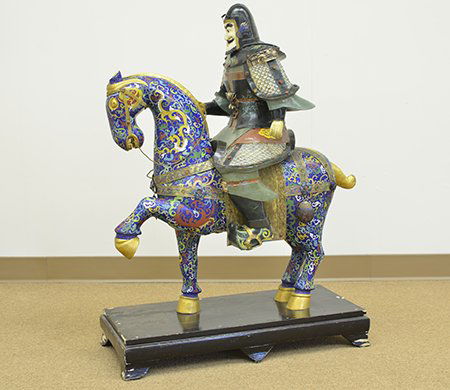 A Large Chinese Cloisonné Horse & Warrior, Republic: A Large Chinese Cloisonné Horse and Warrior Statue, Republic Period, the cloisonné statue of a caparisoned standing horse mounted by a painted and carved wood warrior with a carved ivory face, the s