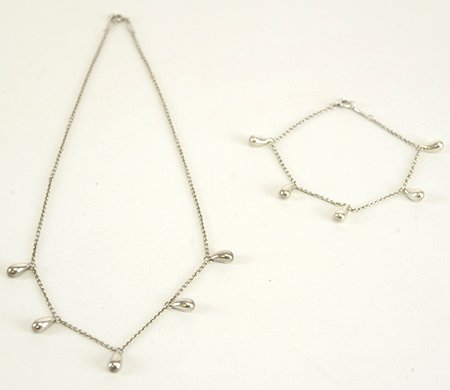 Tiffany & Co. 'Teardrop' Necklace & Bracelet: Tiffany & Co. 'Teardrop' Necklace & Bracelet, designed by Elsa Perretti, the sterling silver bracelet with five teardrops measuring 7" long, the matching necklace 16" long, both marked Tiffany & Co, 9