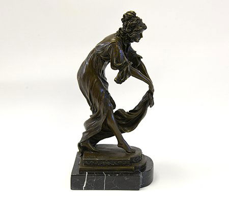 Signed Claire J. R. Colinet Bronze Sculpture: Early 20th Century Bronze Sculpture, Claire Jeanne Roberte Colinet (1880-1950, Belgian), the bronze sculpture of a woman elegantly bending forward to catch the train of her Greek key trimmed dress, si