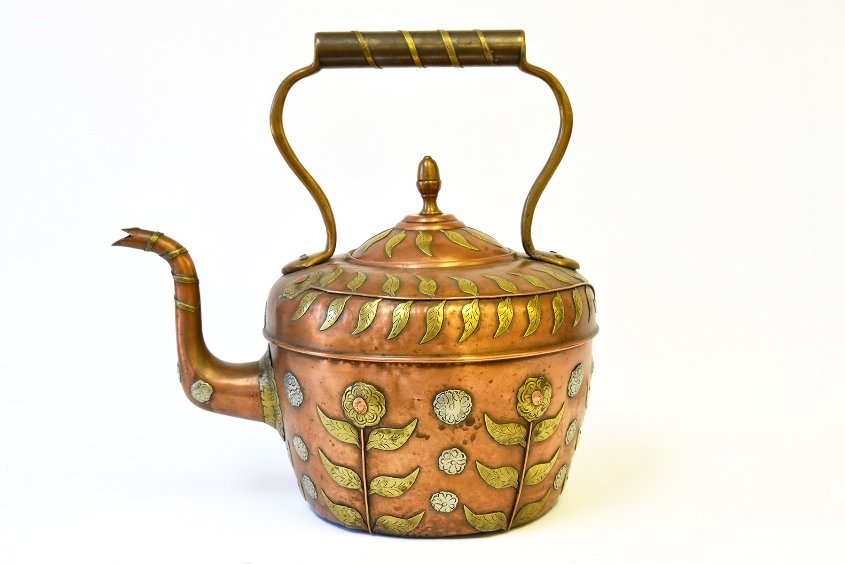 A Late 19th C. English Copper and Brass Teapot: A Late 19th C. English Copper and Brass Teapot, the arts and crafts style teapot with sunflower and vines, the lid with marks for Geo. Robbins & Co., Birmingham, the handle marked 10, with dents to ba