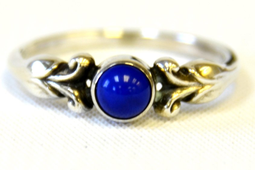 A Georg Jensen Sterling Silver Ring: A Georg Jensen Sterling Silver Ring, the sterling ring with single stone, possibly blue agate, marked to the inside with George Jensen, 55, 925.5 Denmark.