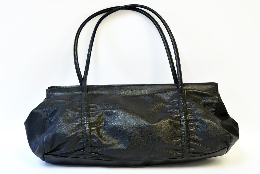 A Miu Miu Black Leather Purse: A Miu Miu Black Leather Purse, appx. 16 in. W, 6 1/2 in. H.