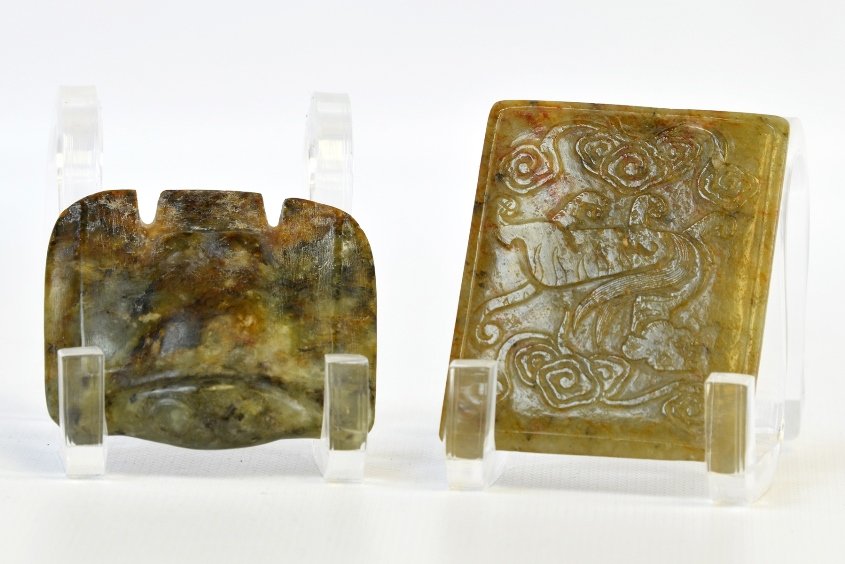 A Chinese Soapstone Belt Buckle and Tip: A Chinese Soapstone Belt Buckle and Tip, the belt cover carved with a pixiu, with inscription to clasp, and Chinese characters on the back, both with surface wear, the buckle appx. 2 1/4 in. H.