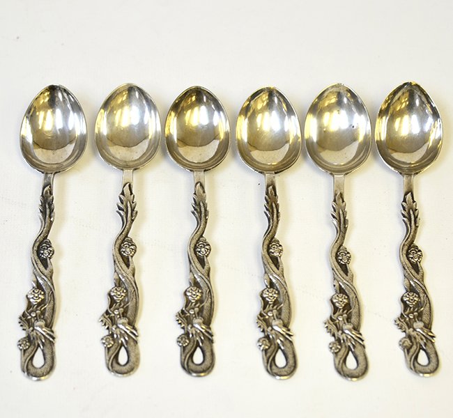 A Set of Chinese Export Silver Tea Spoons: A Set of Chinese Export Silver Tea Spoons, including six teaspoons with carved dragon handles, the undersides with marks, appx. 5 5/8 in. W.