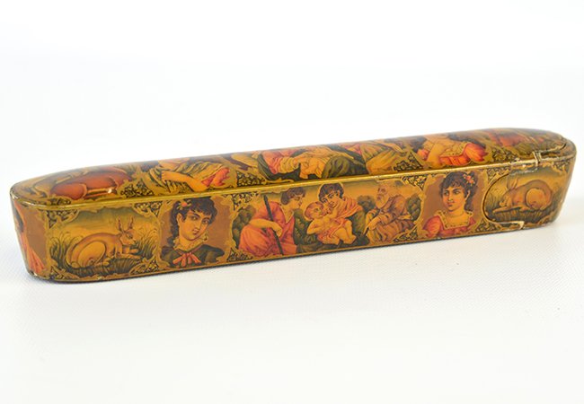 A Qajar Lacquered Papier-Mache Pencase: A Qajar Lacquered Papier-Mache Pencase, of typical elongated form, with medallions containing religious scenes to the top and sides, with wear and damage to surface, appx. 8 7/8 in. W.