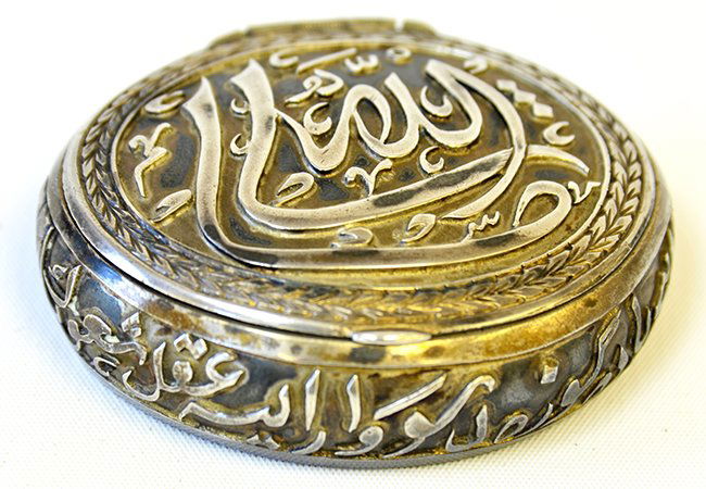 A 19th Century Islamic Silver Snuff Box: A 19th Century Islamic Silver Snuff Box, the box carved with inscription to top and sides, the base with marks, appx. 2 1/2 in. W, 2 1/4 in. D.