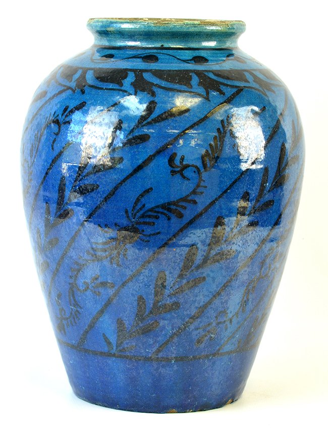 A Middle Eastern Turquoise Glaze Vase: A Middle Eastern Turquoise Glaze Vase, with black floral decoration on a turquoise ground, appx. 13 in. H., 9 1/2 in. DIA._x000D_ _x000D_