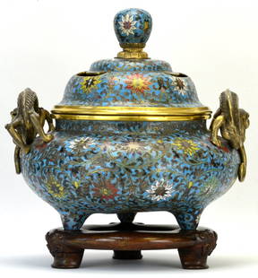 A Chinese Cloisonne Censer, Qing Dynasty: A Chinese Cloisonne Censer, likely Qing Dynasty, the censer mounted with handles in the form of a sinuous dragon with back turned head and bifurcated tail, the body of the censer enameled with lotus b