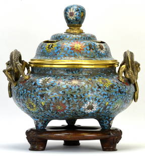 A Chinese Cloisonne Censer, Qing Dynasty: A Chinese Cloisonne Censer, likely Qing Dynasty, the censer mounted with handles in the form of a sinuous dragon with back turned head and bifurcated tail, the body of the censer enameled with lotus b