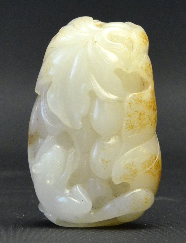 An 18th C. Chinese White Jade Snuff Bottle: An 18th C. Chinese White Jade Snuff Bottle, in the form of a squirrel climbing on a leaf wrapped bunch of grapes, appx. 2 1/4 in. H. Provenance: From a Newport, Rhode Island Estate.