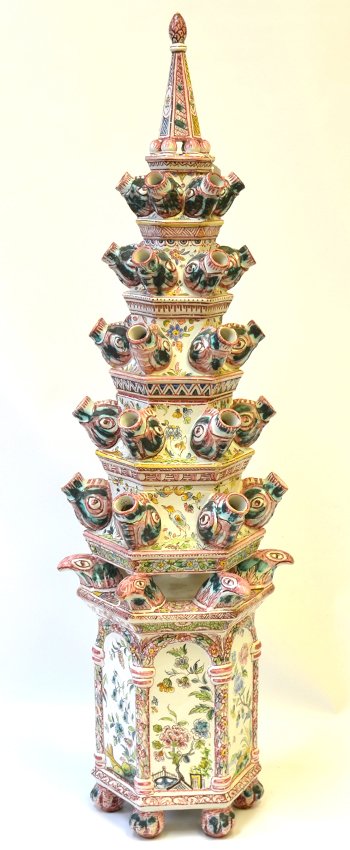 A Continental Majolica Tulipiere, 18th/19th: A Continental Majolica Tulipiere, late18th/19th Century, the flower pyramid with five tiers each with six spouts, the tiers raised on bird heads supported by a hexagonal pedestal painted with flowerin