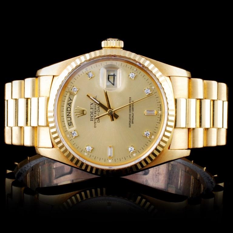 Rolex 18K DayDate Men's Diamond Wristwatch: Estimated Retail Replacement Value: $38,500.00Ref: WAG44000Item no.: ARXD012Specification:Model: Oyster Perpetual Day-DateMovement: Perpetual, Self WindingCase Material: 18K Yellow GoldBracelet Materi