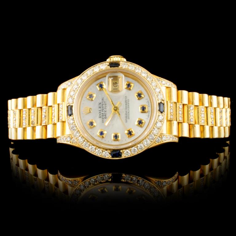 Rolex DateJust 18K YG 1.50ct Diamond Ladies Watch: Ref: WAG32000 Specification: Model: DateJust Movement: Perpetual, Self Winding Function: Instantaneous Quick Set Date Case Size: 26mm Case Material: Rolex 18K Yellow Gold, Diamond Lugs *(Custom Set) B