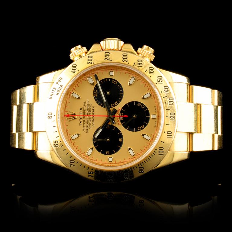 Rolex DAYTONA Paul Newman 18K Gold 40MM Wristwatch: Ref: WAG96000Specification:Model: Daytona Cosmograph Movement: Self Winding ChronometerFunction: Chronograph Case Size: 40mmCase Material: 18K Yellow Gold Bracelet Materials: 18K Yellow Gold Bracelet