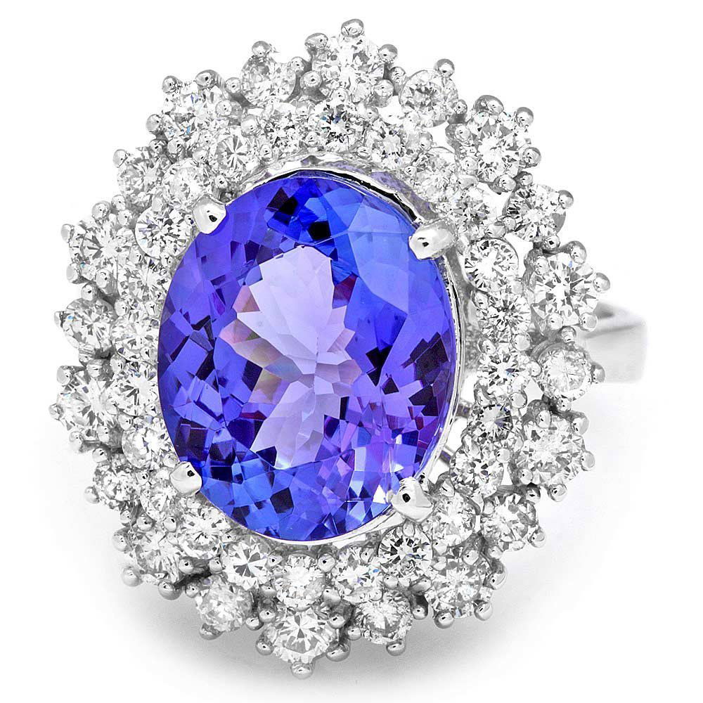 18k Gold 5ct Tanzanite 1.60ct Diamond Ring: This stunning ladies ring is crafted in solid 18k White Gold and features a 5.00 carat 100% Natural Tanzanite mined from Tanzania + accented with 44 sparkling eye-clean natural Diamonds, totaling 1.60