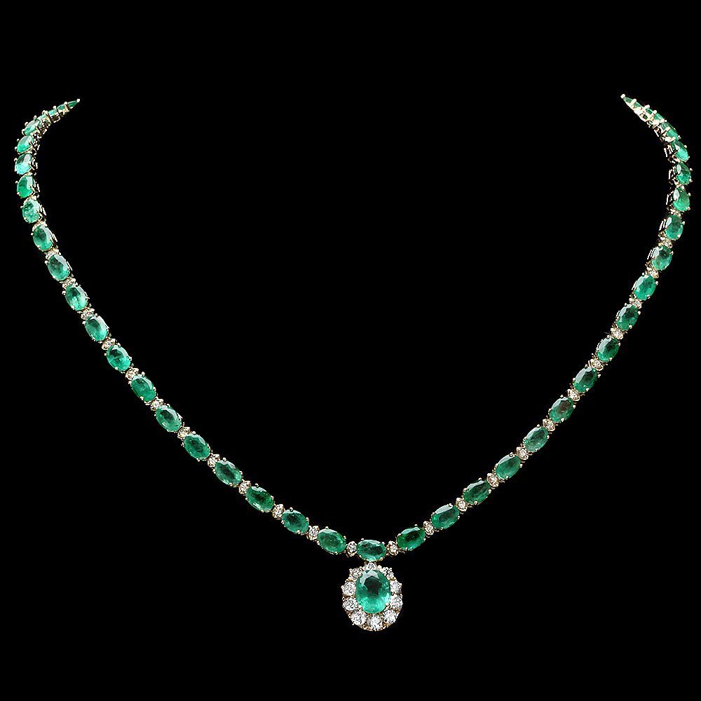 14k Gold 24ct Emerald 2ct Diamond Necklace: This elegant ladies necklace is crafted in solid 14k Yellow Gold and features a 1.50 carat 100% Natural Emerald mined from Colombia + accented with 63 sparkling eye-clean natural diamonds, totaling 2.