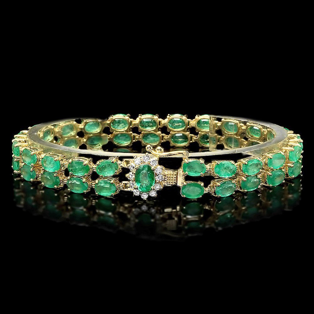 14k Gold 18ct Emerald 0.40ct Diamond Bracelet: This lovely ladies bracelet is crafted in solid 14k Yellow Gold and features a 1 carat 100% Natural Emerald mined from Colombia + accented with 12 sparkling eye-clean natural diamonds, totaling 0.40 c