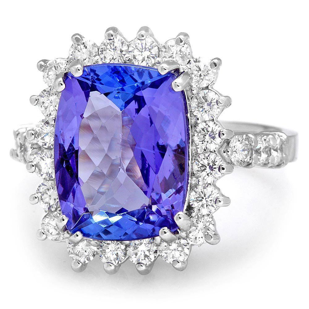 18k Gold 5ct Tanzanite 1.10ct Diamond Ring: This elegant ladies ring is crafted in solid 18k White Gold and features a 5.00 carat 100% Natural Tanzanite mined from Tanzania + accented with 26 sparkling eye-clean natural Diamonds, totaling 1.10