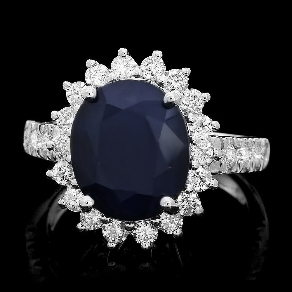 14k Gold 5ct Sapphire 1ct Diamond Ring: This luxurious ladies ring is crafted in solid 14k White Gold and features a 5.00 carat Natural Sapphire mined from Sri Lanka + accented with 26 sparkling eye-clean natural diamonds, totaling 1.00 car