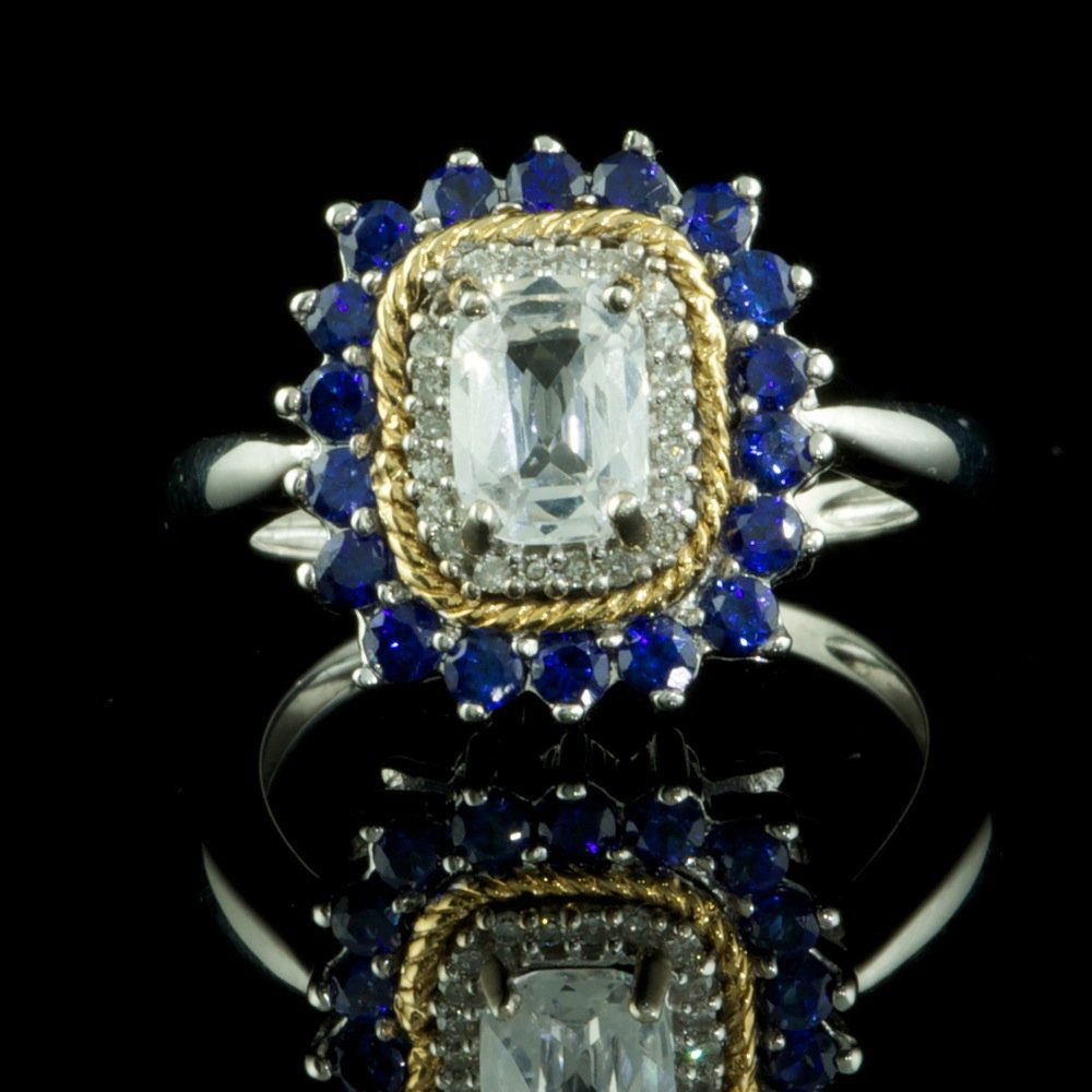 925 Sterling, 1CT Topaz & .10CT Diamond Ring: 925 Solid Sterling Silver, 1CT Topaz & .10CT Diamond with Treated Sapphire Ladies Ring. Excellent Craftsmanship - Total Weight of Ring: 6 Grams.