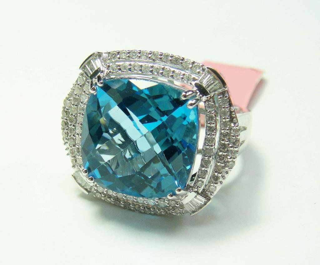 14KT Gold, 13.29ct Blue Topaz & 0.73 Diamond Ring: Certified 14KT White Gold, 13.29ct Blue Topaz & 0.73ctw (SI -I1, G-I) Diamonds Ladies Ring. Certificate of Appraisal is included.