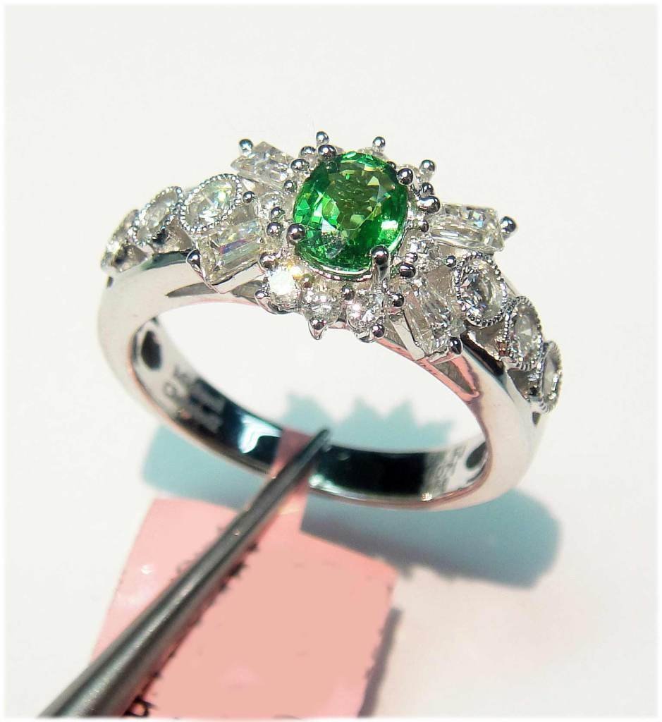 18KT Gold, 0.57ct Tsavorite & 0.71ctw Diamond Ring: NATURAL 0.57ct Tsavorite & 0.71ctw (VS2-SI3, Color G-I) Diamonds 18KT Ladies Gold Ring. Total Weight of Ring: 5 grams. R3200