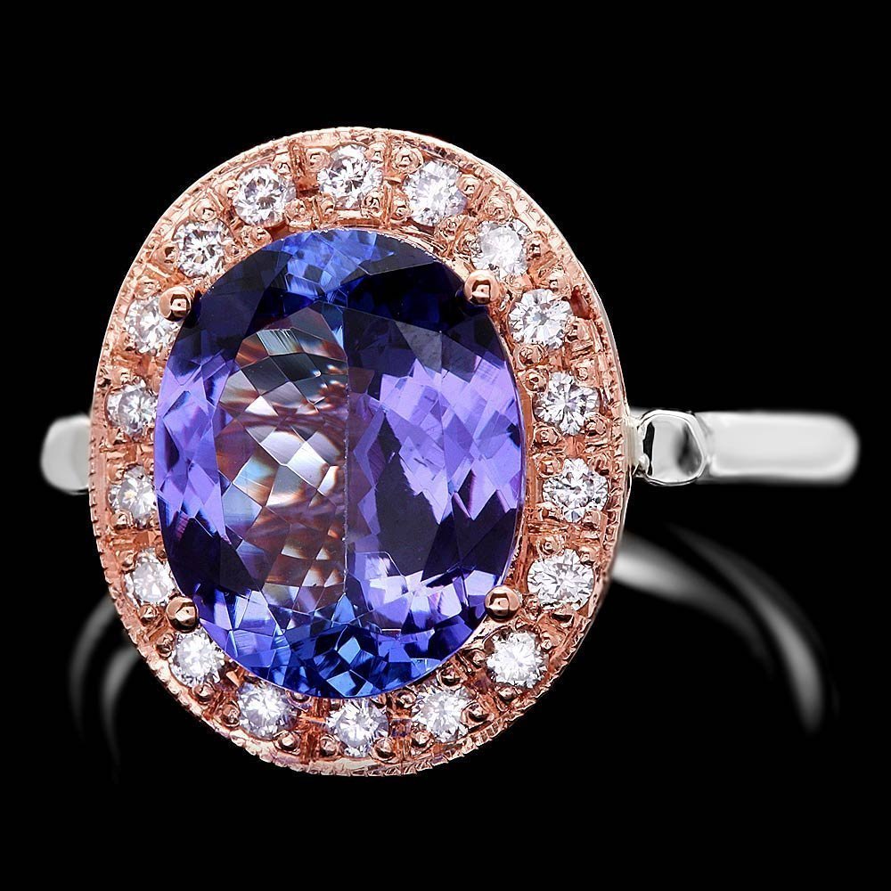 14k Gold 5ct Tanzanite .40ct Diamond Ring: This elegant ladies ring is crafted in solid 14k Multi-Tone Gold and features a 5.00 carat 100% Natural Tanzanite mined from Tanzania + accented with 18 sparkling eye-clean natural Diamonds, totaling