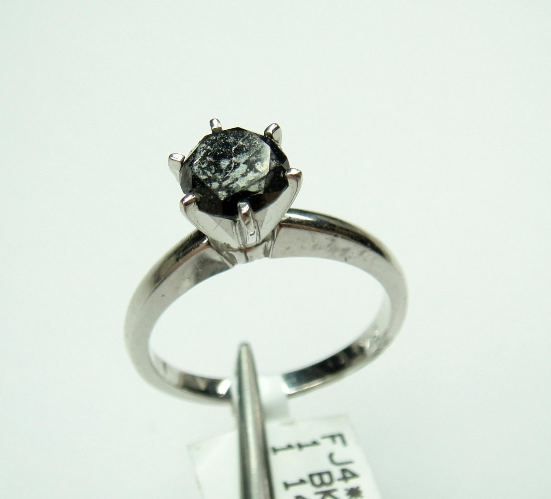 14Kt White Gold, 1.25ct Black Diamond solitaire Ring. C: 14Kt White Gold, 1.25ct Black Diamond solitaire Ring. Certificate of appraisal is included.