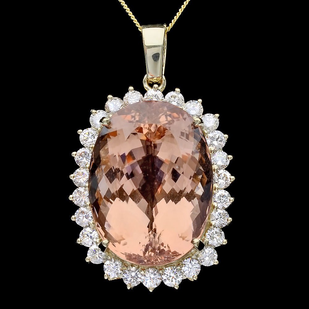 14k Gold 42ct Morganite 2.9ct Diamond Pendant: This luxurious ladies pendant is crafted in solid 14k Yellow Gold and features a 42.00 carat 100% Natural Morganite mined from Brazil + accented with 26 sparkling eye-clean natural Diamonds, totaling 