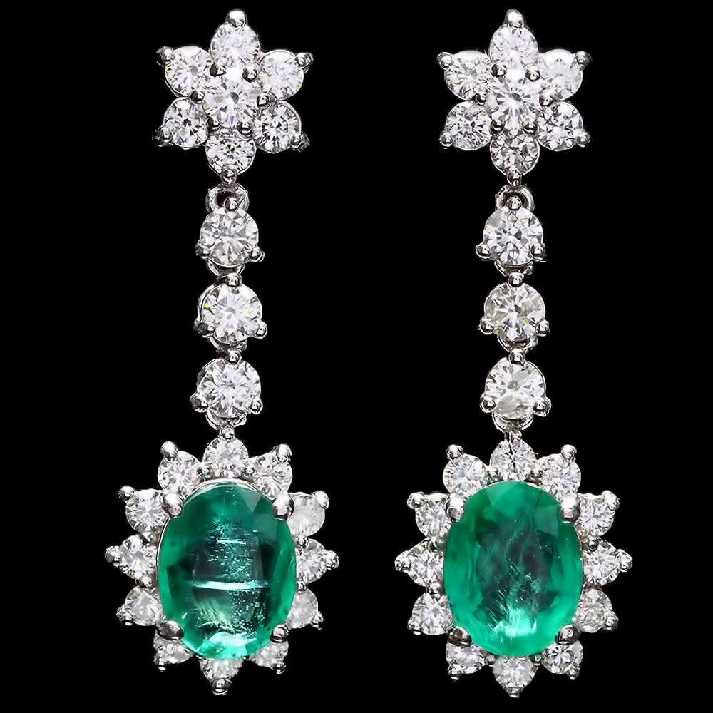 14k W Gold 3.50ct Emerald 2.50ct Diamond Earrings: These luxurious ladies earrings is crafted in solid 14k White Gold and features 2 (3.50 ctw) 100% Natural Emeralds mined from Colombia + accented with 44 sparkling eye-clean natural Diamonds, totaling