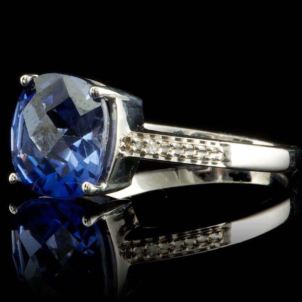 925 Sterling Silver 3ct Sapphire Diamond Ring: Retail: $100.00 Metal: .925, Sterling Silver Size: 7.25 Total Item Weight: 3.0 grams Main Stone: Sapphire Color: Blue Carat Total Weight: 3.00 Treatment: Created Clarity: Type 2 Cut: Very Good Seconda