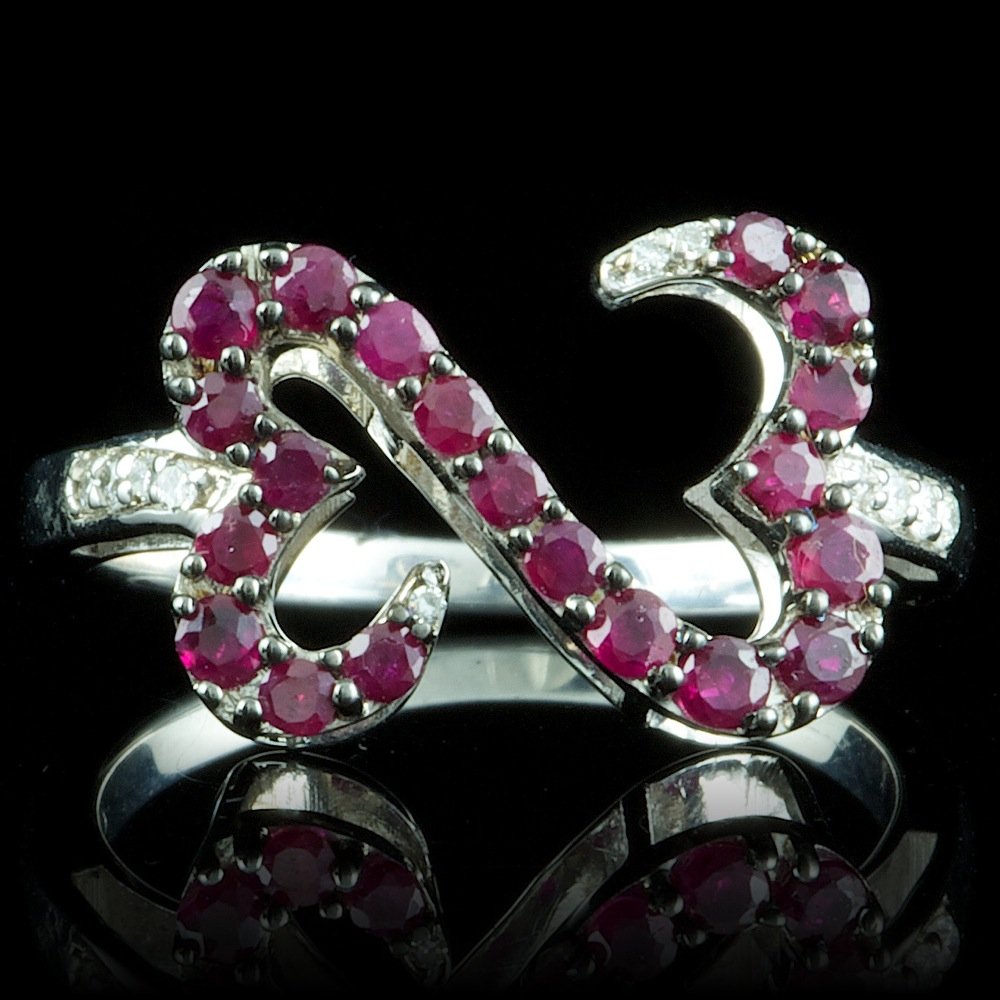 Sterling Silver 0.20ct Ruby 0.07ct Diamond Ring: Retail: $100.00 Metal: .925, Sterling Silver Size: 7.25 Total Item Weight: 3.6 grams Main Stone: Ruby Color: Red Carat Total Weight: 0.20 Treatment: Created Clarity: Type 2 Cut: Very Good Secondary St